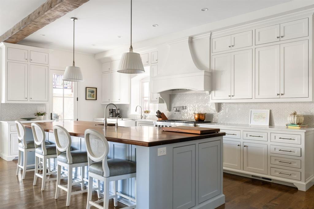 7130 Brookcove Lane Dallas, TX 75214 - Photo 3 of 40 a kitchen with white cabinets and sink