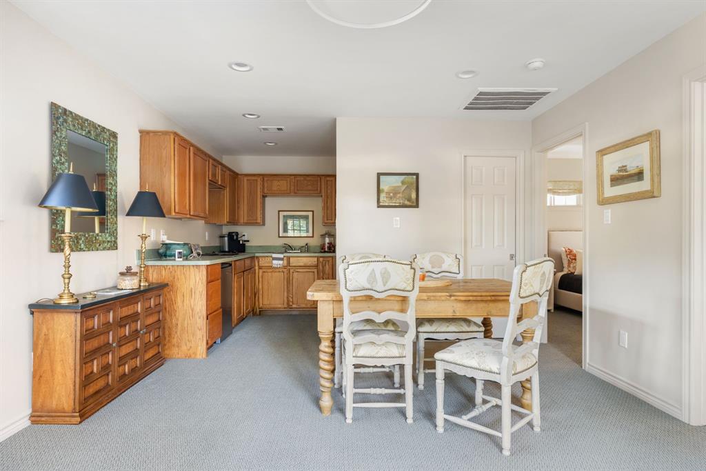 7130 Brookcove Lane Dallas, TX 75214 - Photo 37 of 40 a kitchen with stainless steel appliances kitchen island granite countertop a sink and cabinets