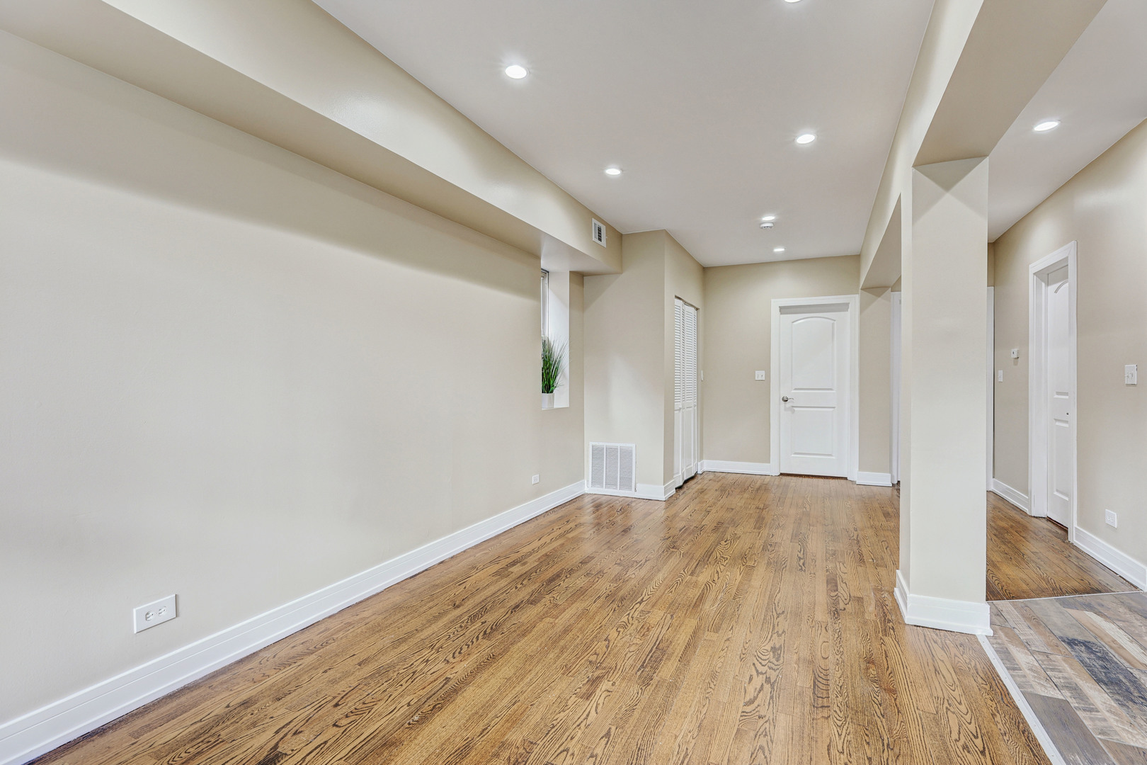 5040 West Berenice Avenue, Unit 1 Chicago, IL 60641 - Photo 4 of 18 a view of livingroom with wooden floor