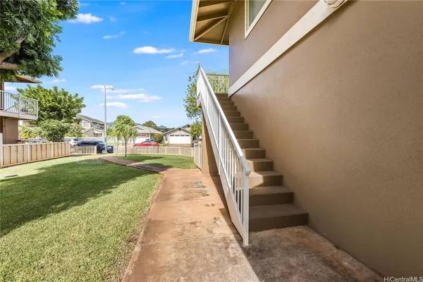 a view of stairs and yard
