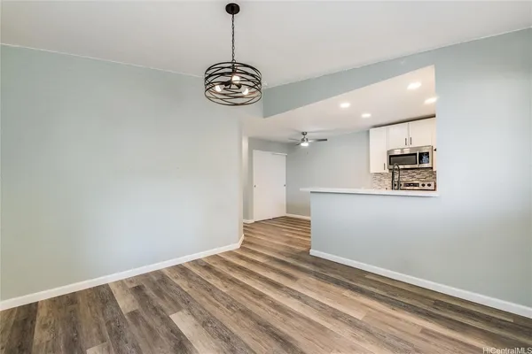 a view of kitchen and an empty space