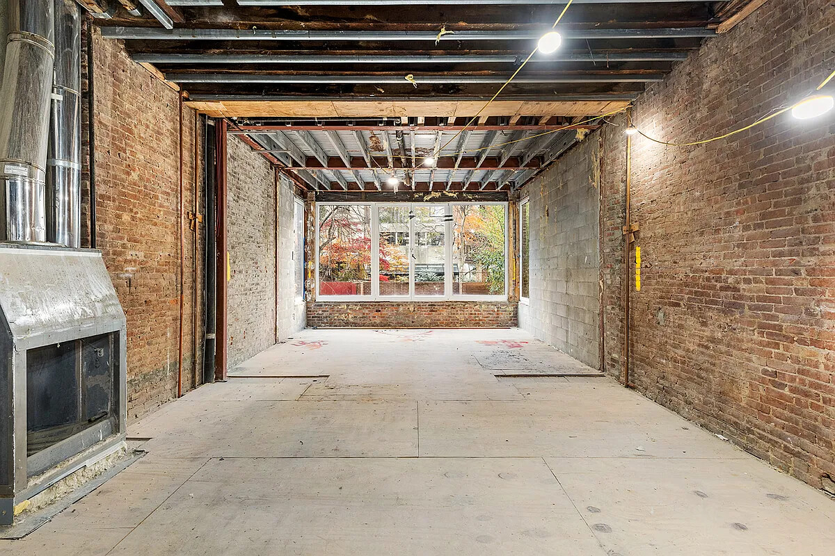 212 East 72nd Street Manhattan, NY 10021 - Photo 5 of 16 a view of entryway with a fireplace and chandelier
