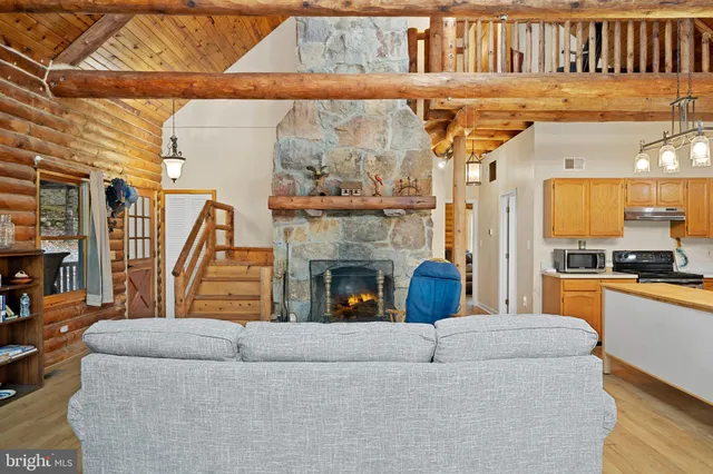 a view of a patio with table and chairs and wooden floor