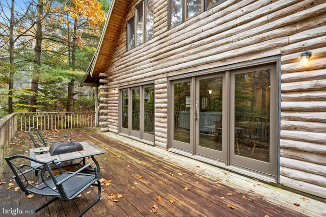 a kitchen with stainless steel appliances granite countertop a refrigerator a stove a sink dishwasher and a refrigerator with wooden floor