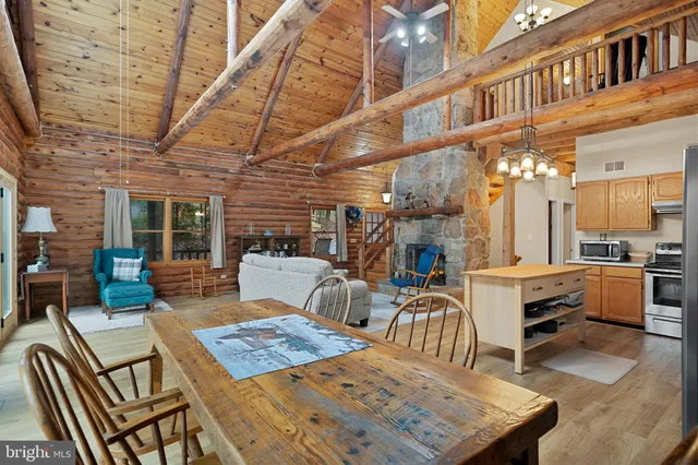 a kitchen with stainless steel appliances granite countertop a stove and a microwave