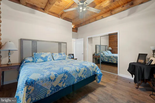 a bedroom with a bed and a couch