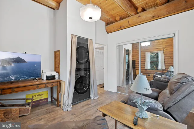 a bathroom with a sink a toilet a mirror and shower