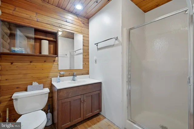 a view of balcony with wooden floor and fence