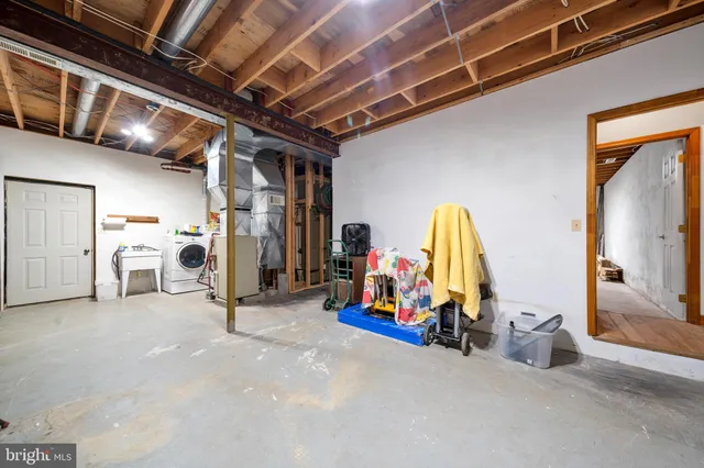 an aerial view of lake and residential houses with outdoor space