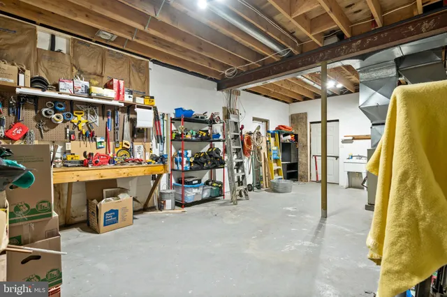 an aerial view of lake and residential houses with outdoor space