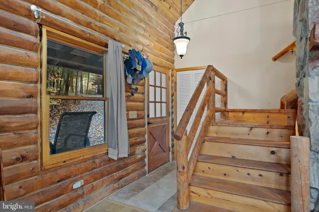a living room with fireplace furniture and a wooden floor