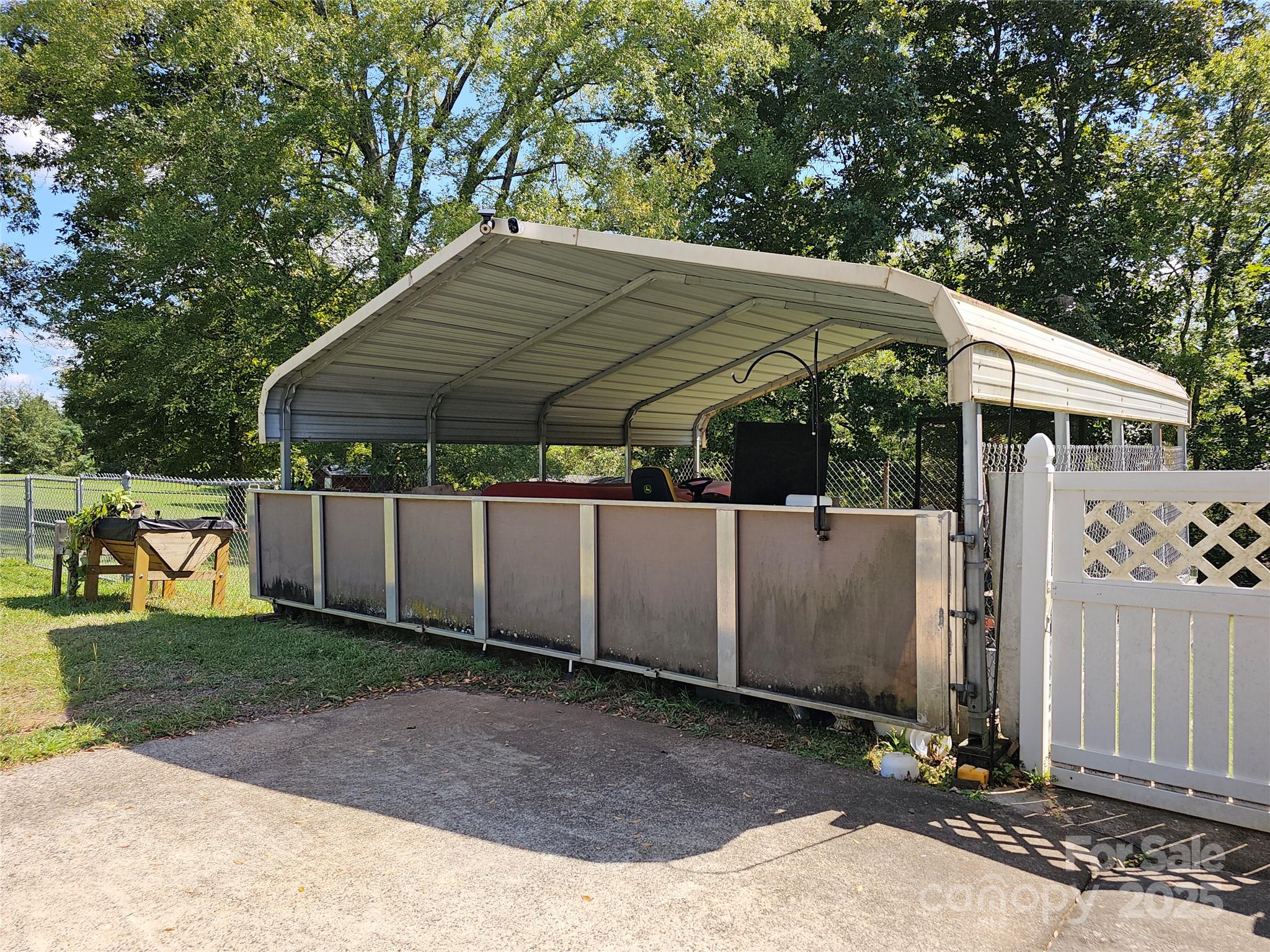 802 Linden Drive Chester, SC 29706 - Photo 28 of 47 a view of a barn with a small yard and a large tree