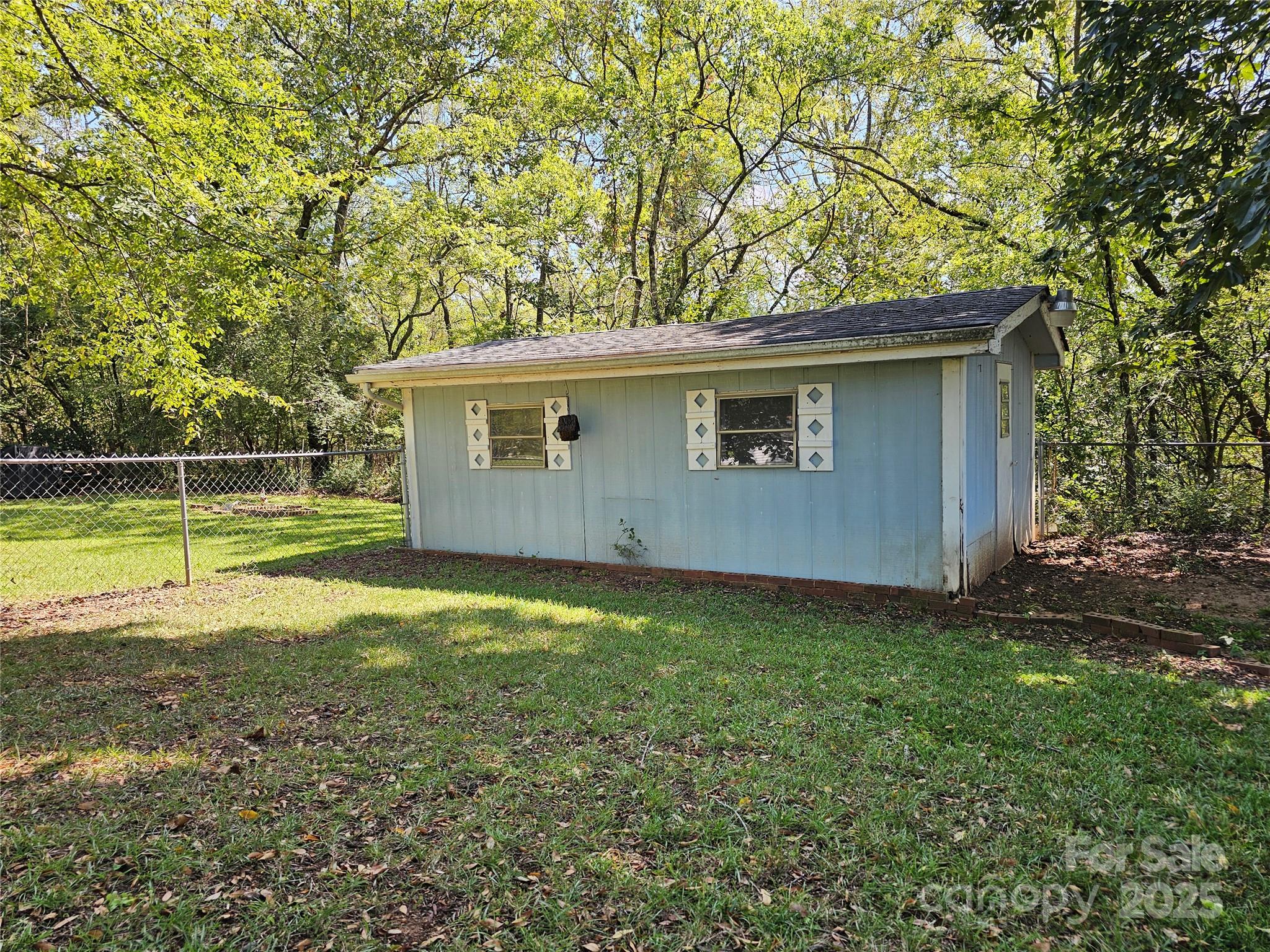 802 Linden Drive Chester, SC 29706 - Photo 37 of 47 a backyard of a house with lots of green space