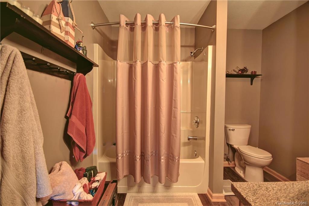 204 Kings Ridge Road Maggie Valley, NC 28751 - Photo 24 of 34 a bathroom with a toilet and shower