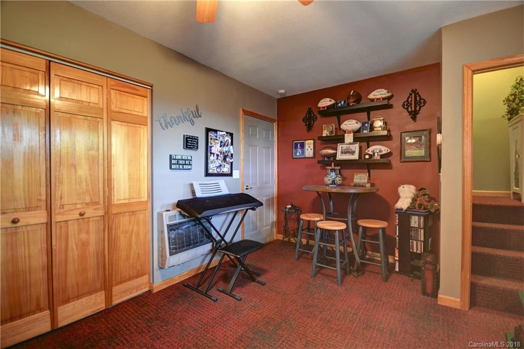 204 Kings Ridge Road Maggie Valley, NC 28751 - Photo 26 of 34 a dining room with furniture and a window