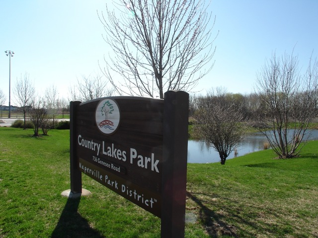 2408 Golf Ridge Circle Naperville, IL 60563 - Photo 20 of 25 a view of a park that has a sign board large trees