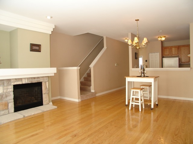 2408 Golf Ridge Circle Naperville, IL 60563 - Photo 9 of 25 a dining room with furniture and fireplace