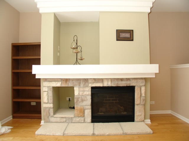 2408 Golf Ridge Circle Naperville, IL 60563 - Photo 10 of 25 a living room with a fireplace