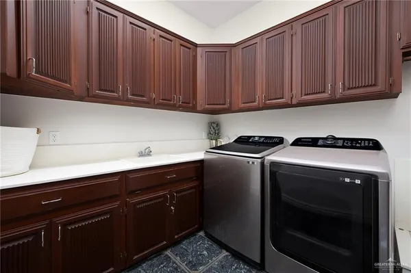 a kitchen with stainless steel appliances a stove a microwave and cabinets