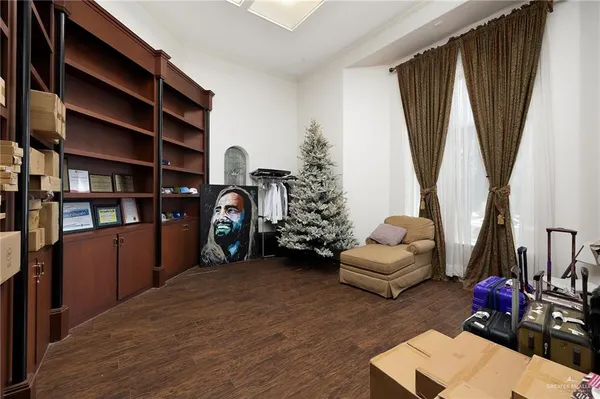a bedroom with furniture and a book shelf