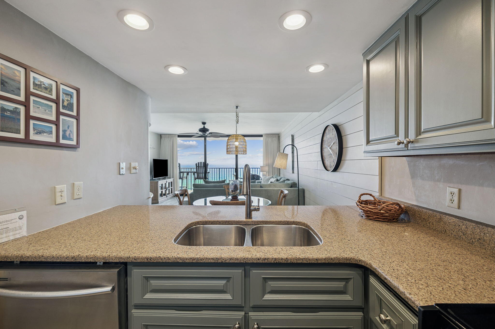 4100 East County Highway 30A, Unit 1004 Santa Rosa Beach, FL 32459 - Photo 12 of 48 a kitchen with granite countertop a sink and cabinets