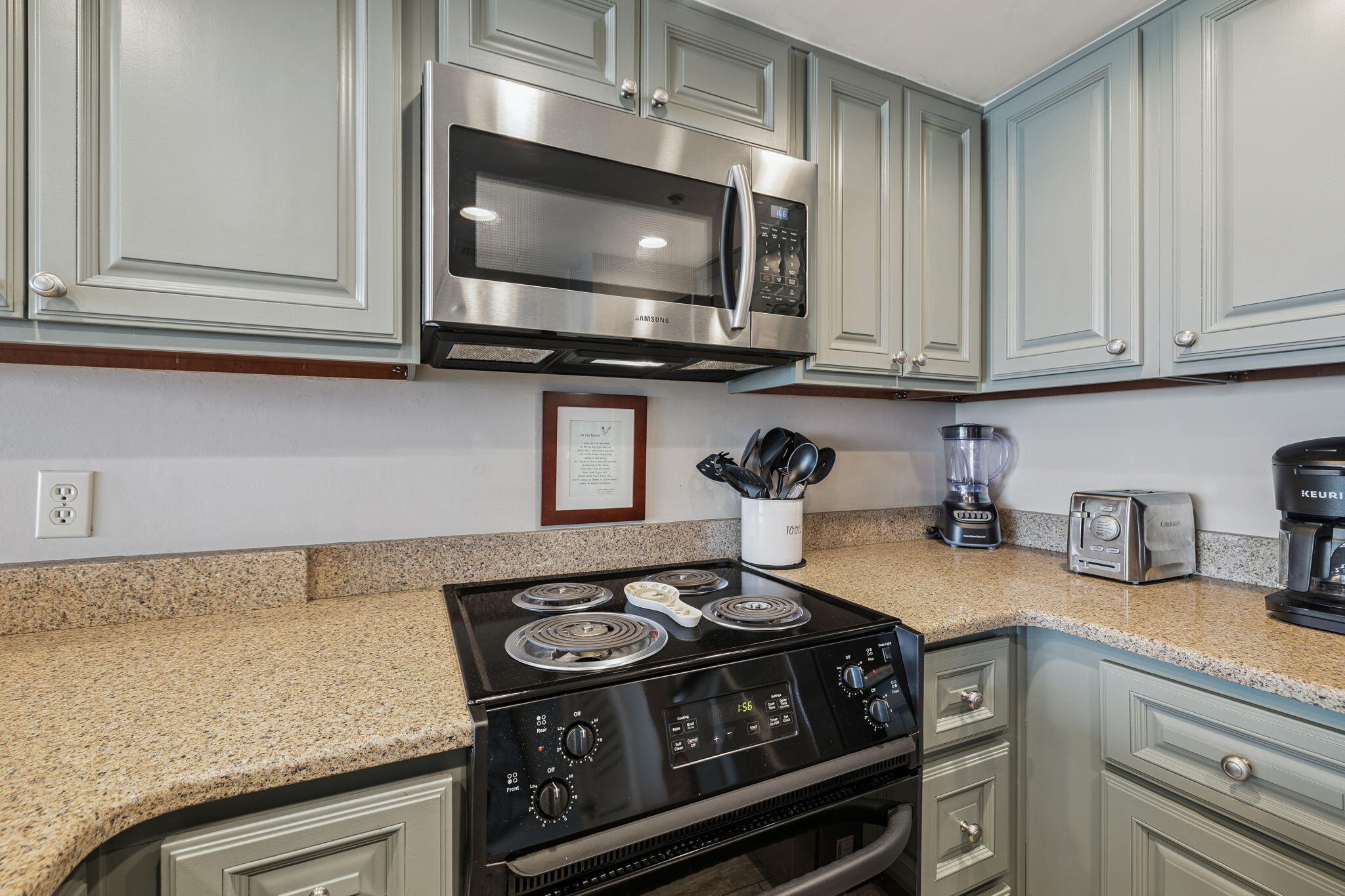 4100 East County Highway 30A, Unit 1004 Santa Rosa Beach, FL 32459 - Photo 14 of 48 a kitchen with a stove and a microwave