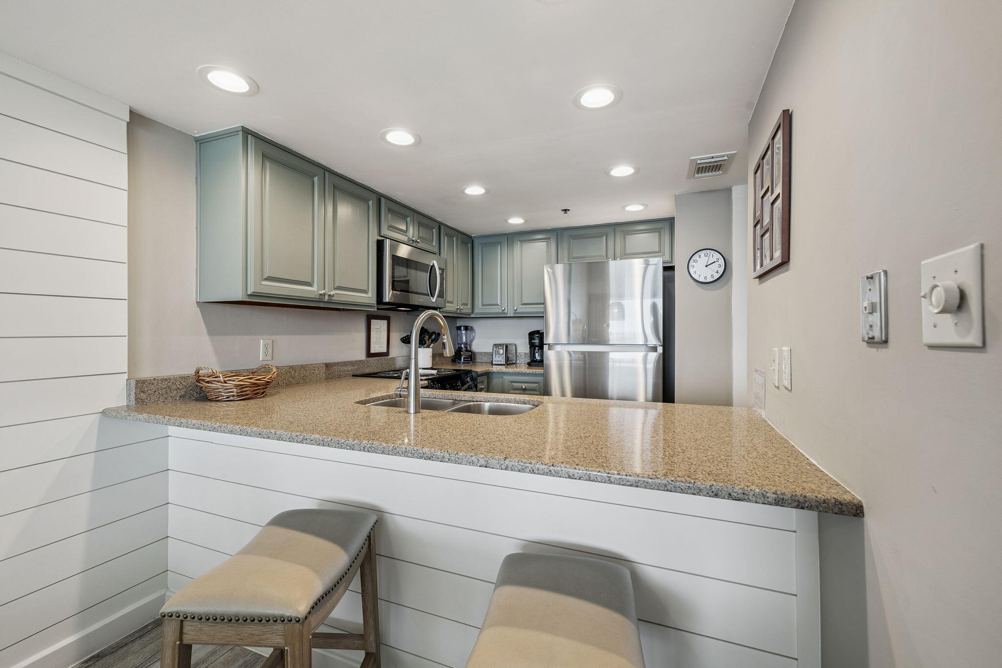 4100 East County Highway 30A, Unit 1004 Santa Rosa Beach, FL 32459 - Photo 16 of 48 a view of a kitchen with stainless steel appliances granite countertop a sink and a refrigerator