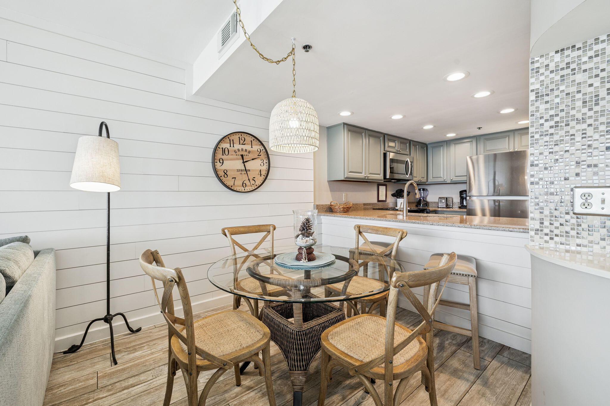 4100 East County Highway 30A, Unit 1004 Santa Rosa Beach, FL 32459 - Photo 18 of 48 a dining room with furniture and a clock