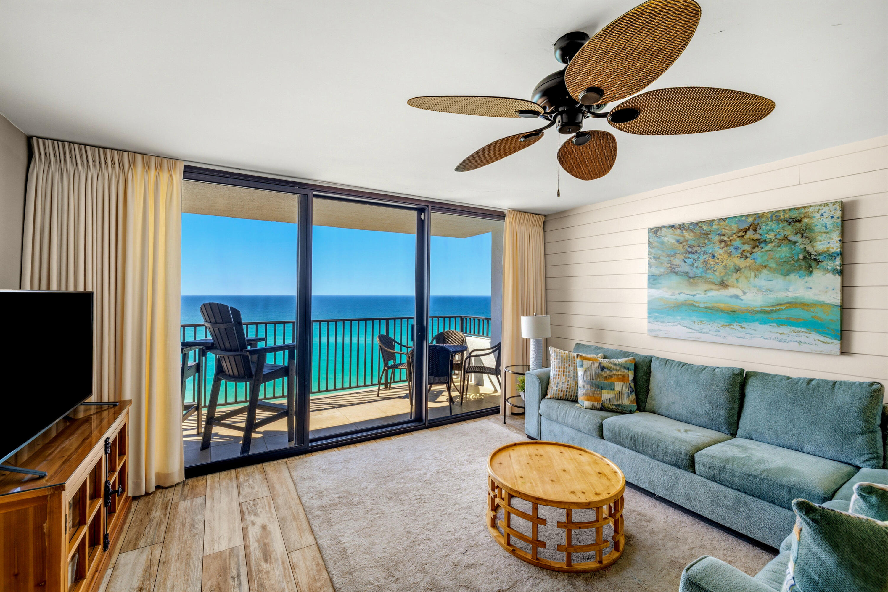 4100 East County Highway 30A, Unit 1004 Santa Rosa Beach, FL 32459 - Photo 2 of 48 a living room with furniture and a flat screen tv