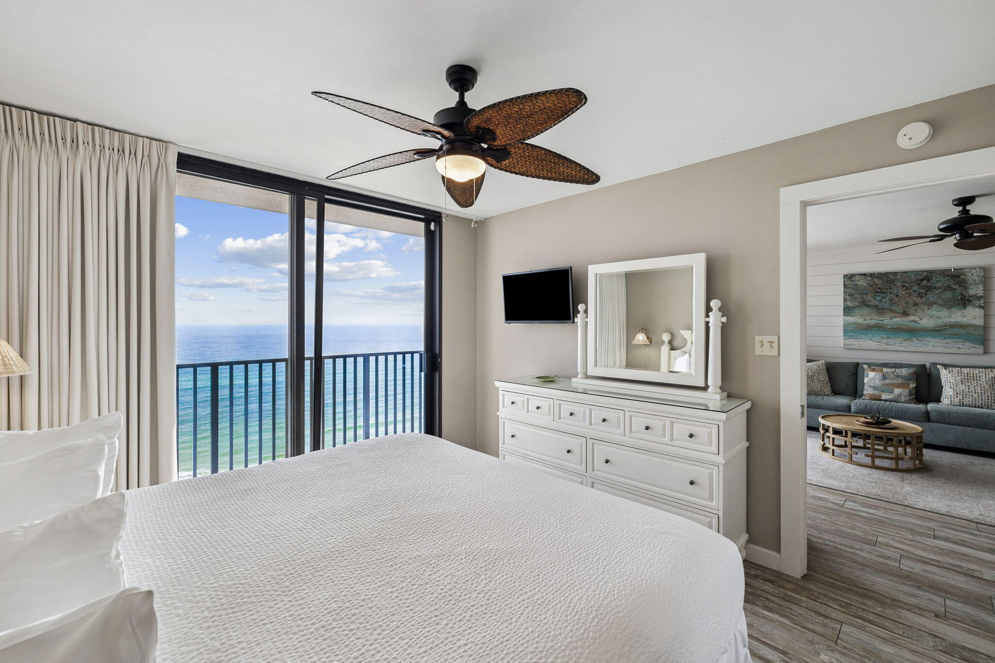 4100 East County Highway 30A, Unit 1004 Santa Rosa Beach, FL 32459 - Photo 21 of 48 a bedroom with a large bed and a flat tv screen on dresser