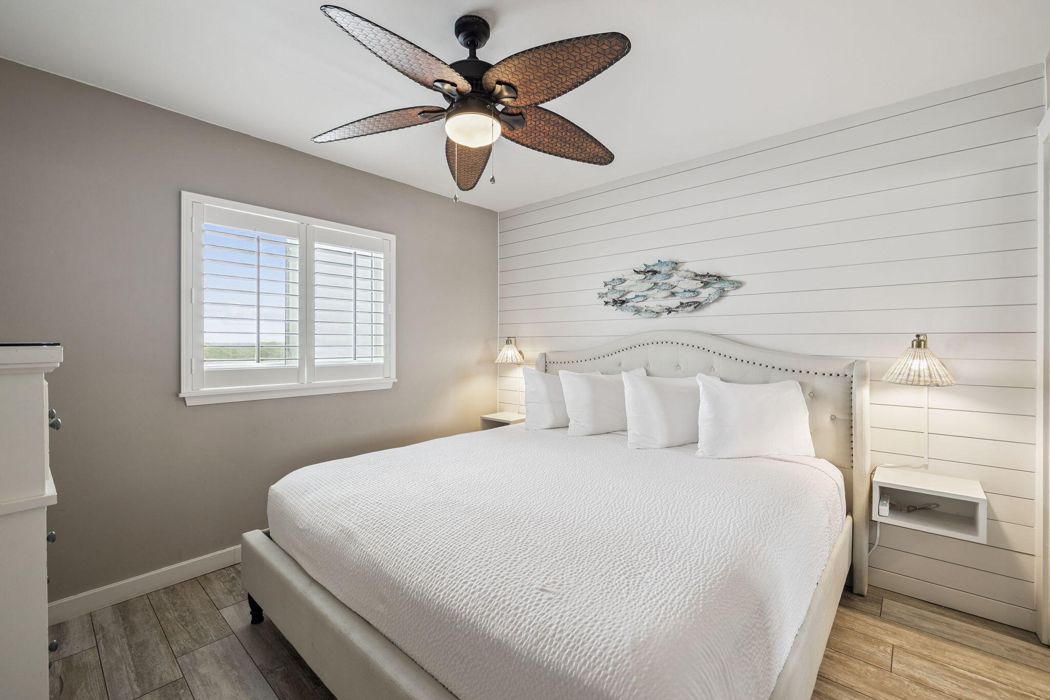 4100 East County Highway 30A, Unit 1004 Santa Rosa Beach, FL 32459 - Photo 22 of 48 a bedroom with a large bed and a chandelier