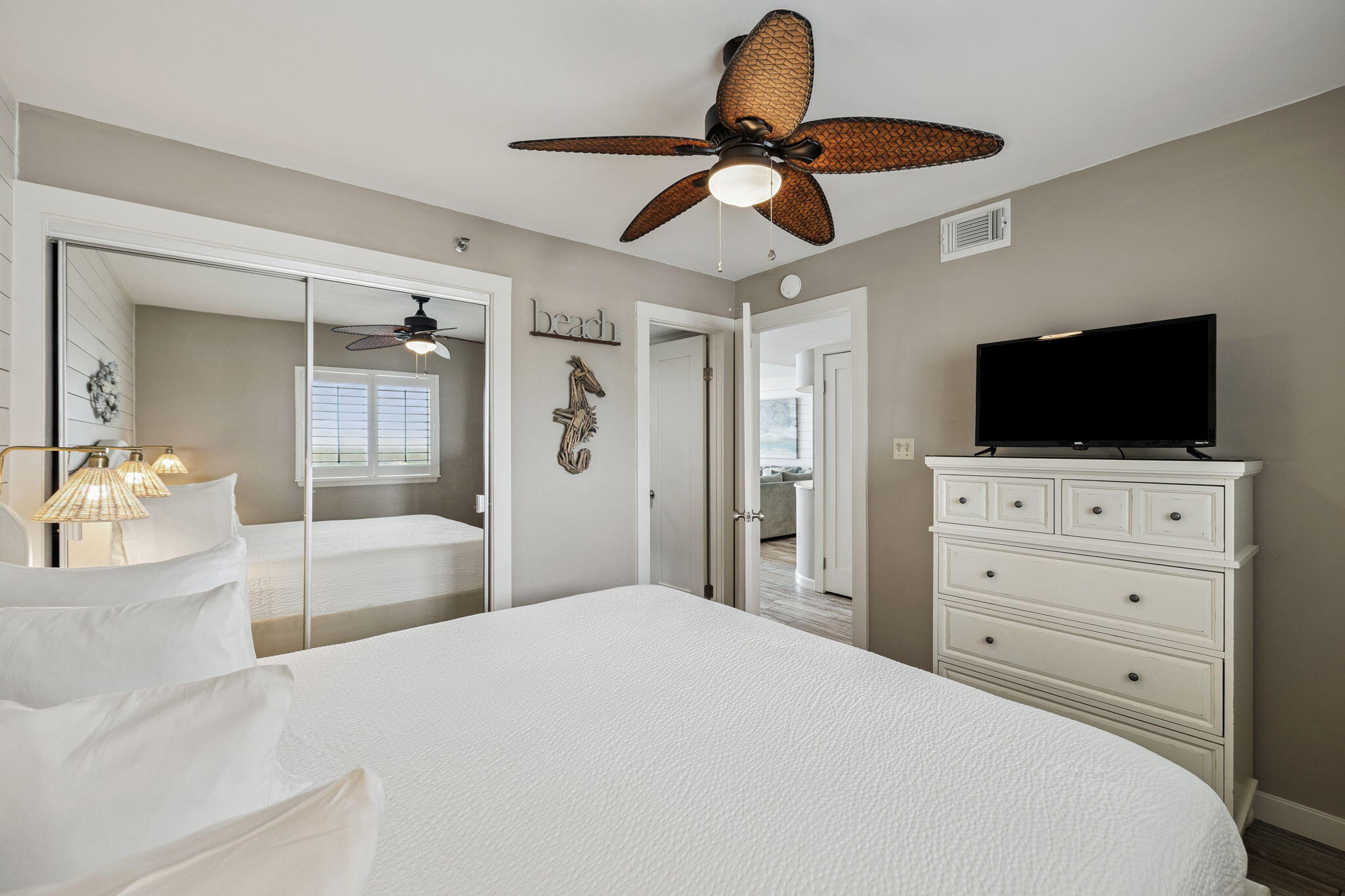 4100 East County Highway 30A, Unit 1004 Santa Rosa Beach, FL 32459 - Photo 23 of 48 a bedroom with a bed and a flat screen tv