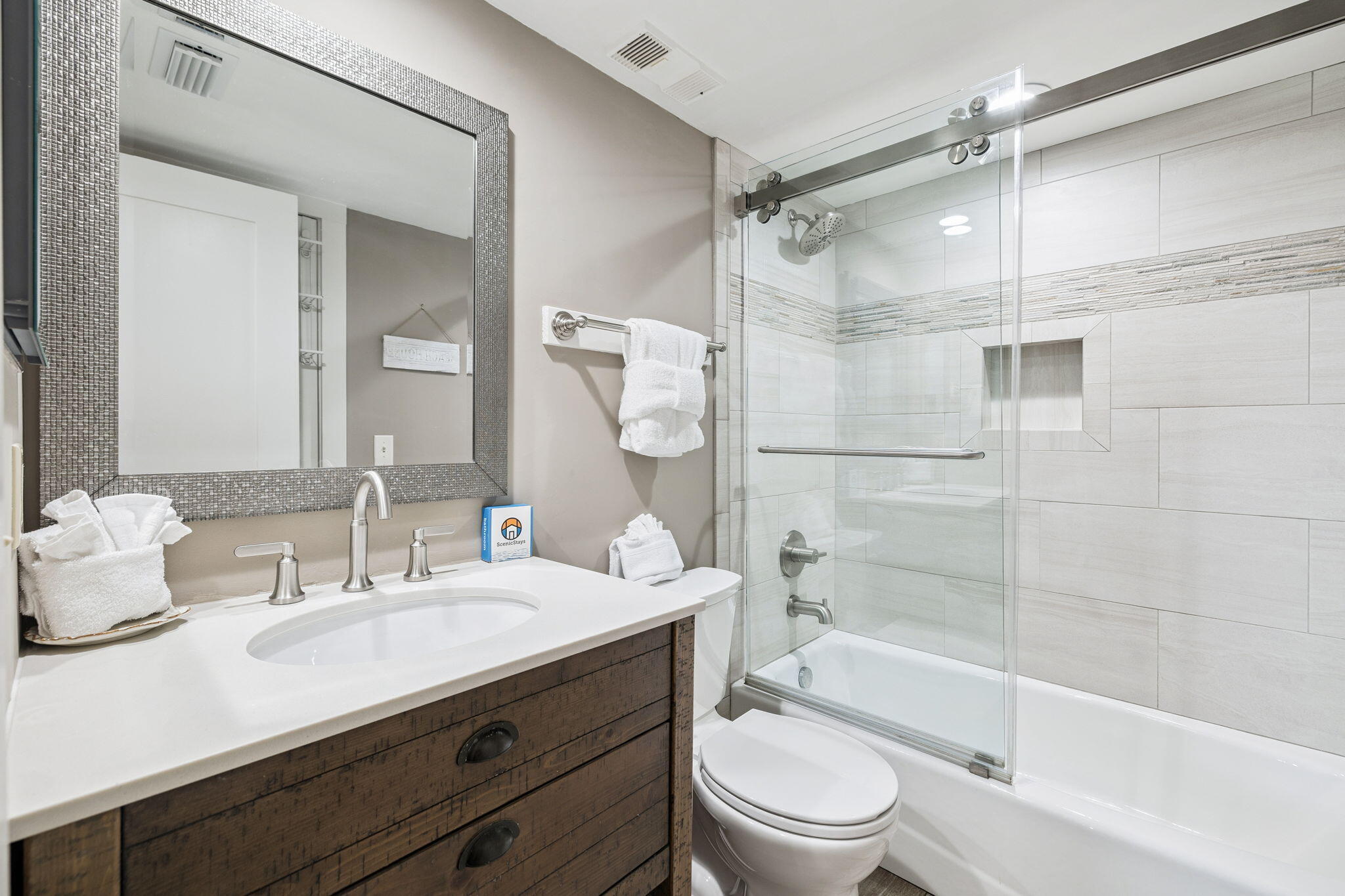 4100 East County Highway 30A, Unit 1004 Santa Rosa Beach, FL 32459 - Photo 24 of 48 a bathroom with a bathtub shower sink vanity and toilet