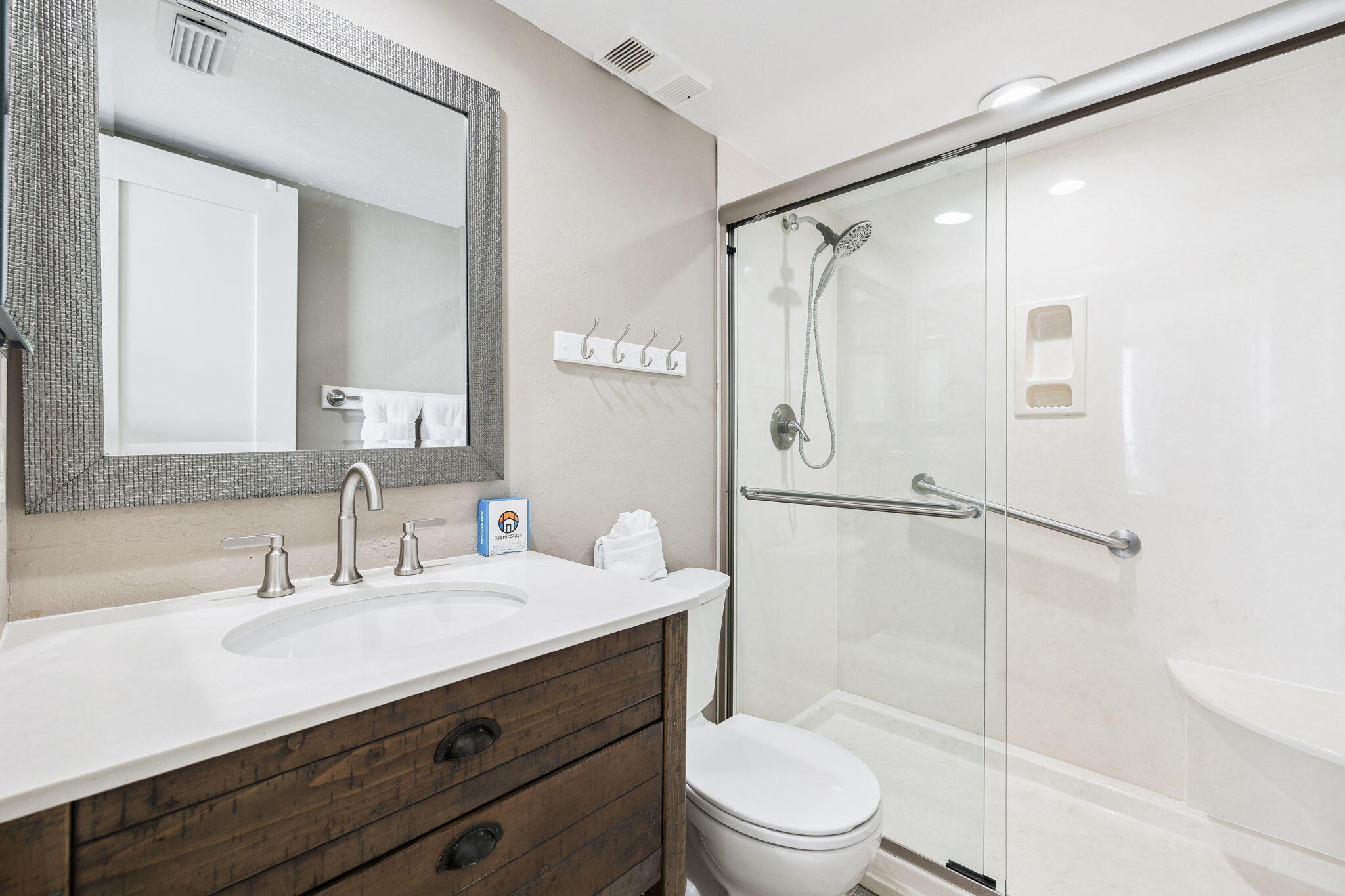 4100 East County Highway 30A, Unit 1004 Santa Rosa Beach, FL 32459 - Photo 26 of 48 a bathroom with a shower sink vanity mirror and toilet