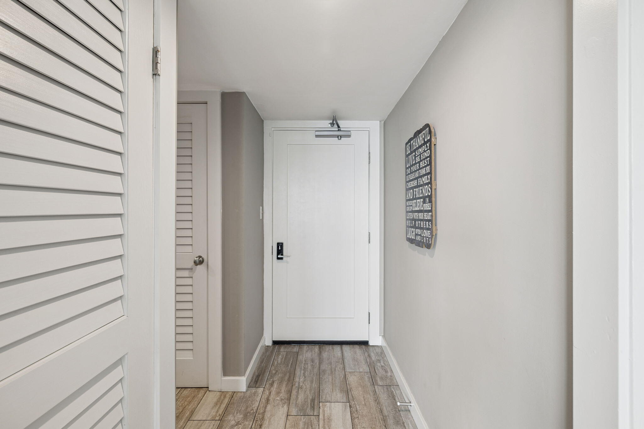 4100 East County Highway 30A, Unit 1004 Santa Rosa Beach, FL 32459 - Photo 27 of 48 a view of a hallway with wooden floor and staircase