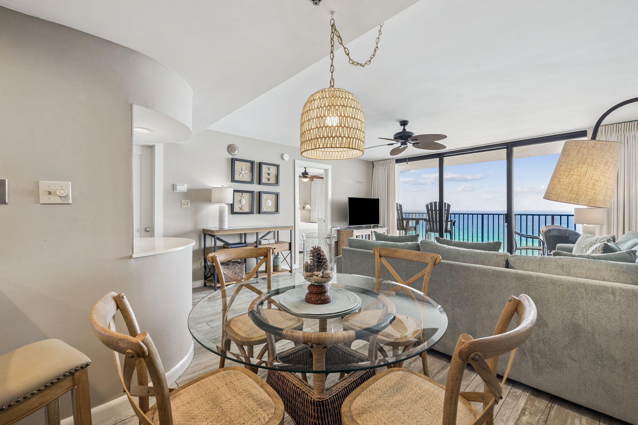 4100 East County Highway 30A, Unit 1004 Santa Rosa Beach, FL 32459 - Photo 9 of 48 a view of a dining room with furniture a chandelier and wooden floor