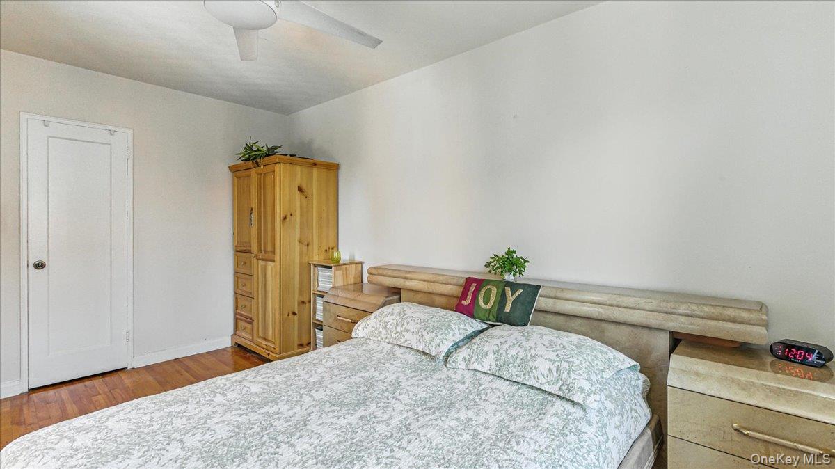 88-10 34th Avenue, Unit 5C Queens, NY 11372 - Photo 14 of 16 a bedroom with a bed and a dresser