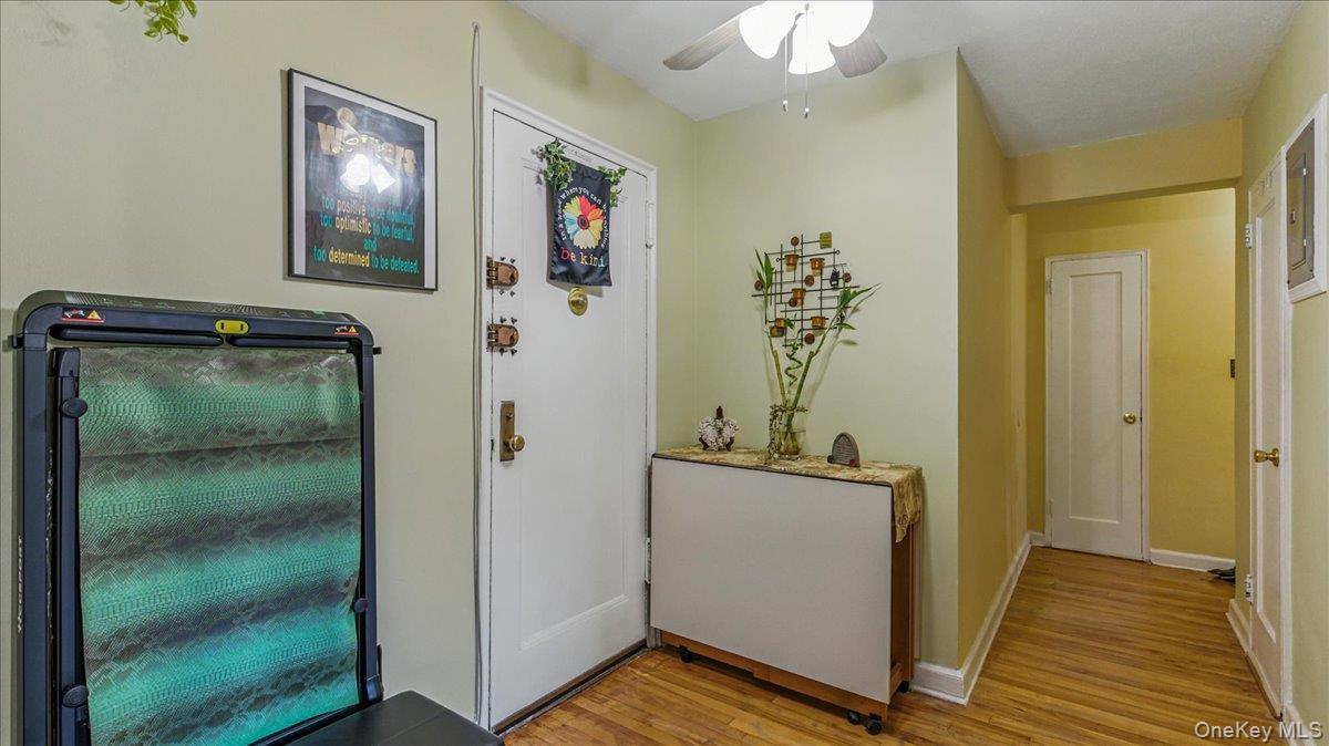88-10 34th Avenue, Unit 5C Queens, NY 11372 - Photo 4 of 16 a view of a hallway a room with wooden floor and closet
