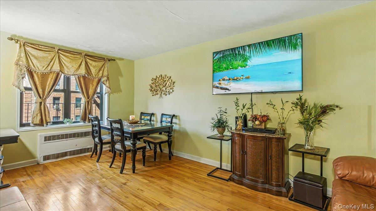 88-10 34th Avenue, Unit 5C Queens, NY 11372 - Photo 5 of 16 a workspace with furniture and window