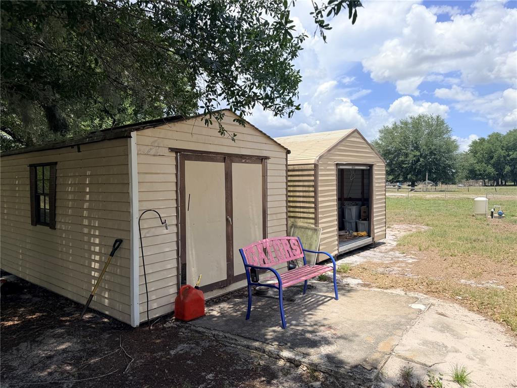 33 Ridge Road Frostproof, FL 33843 - Photo 15 of 21 a backyard of a house with seating space