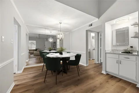 a large kitchen with a table and chairs