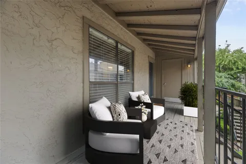a outdoor living space with furniture and a potted plant