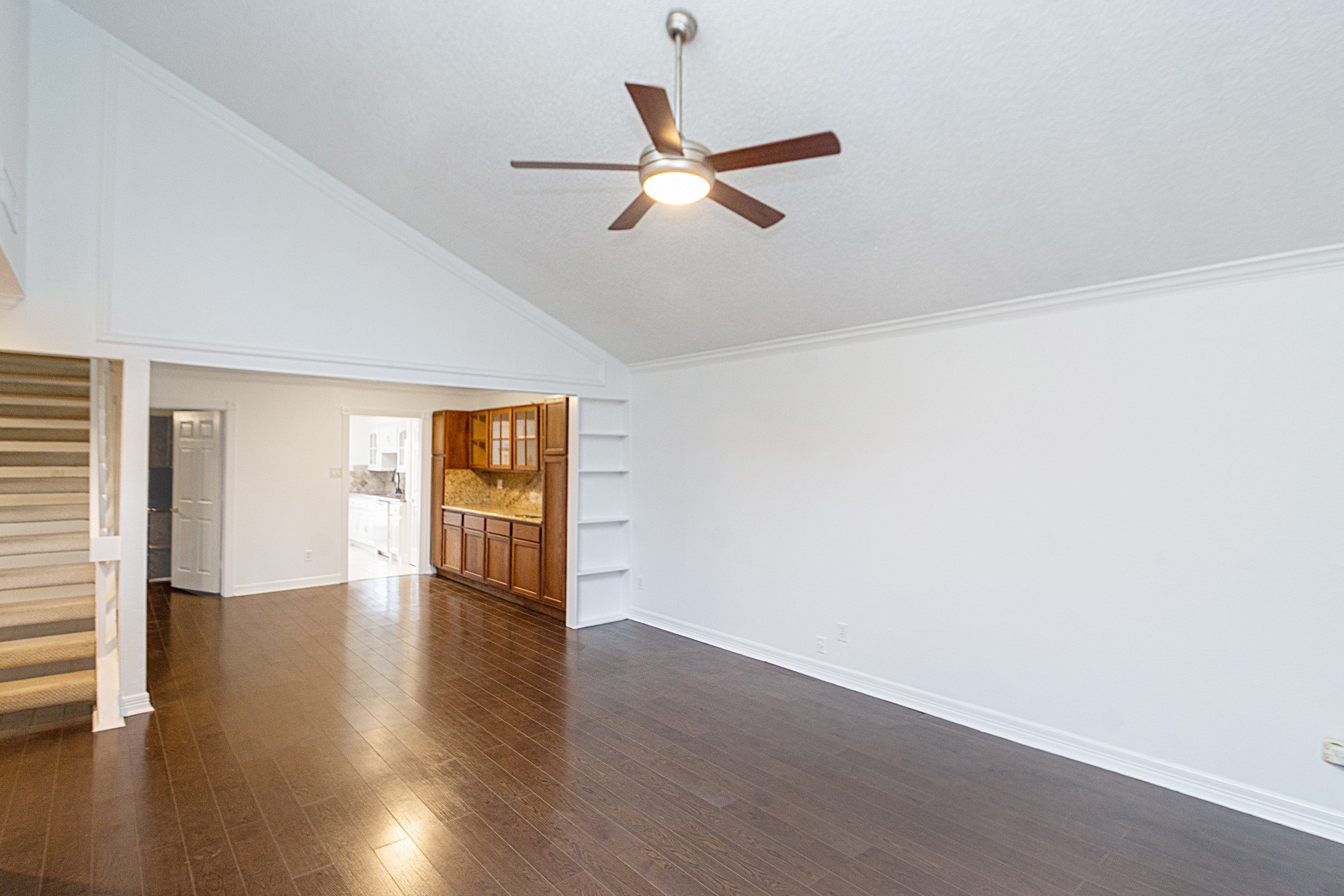 1911 Trixie Lane Houston, TX 77042 - Photo 25 of 43 a view of an empty room with wooden floor and a window