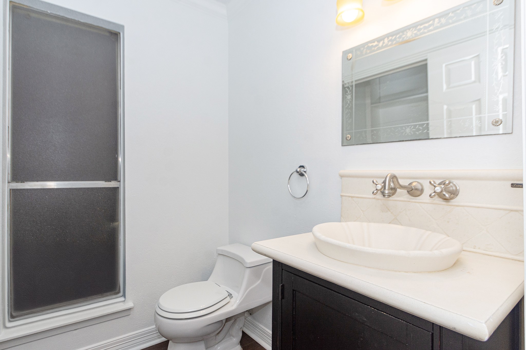 1911 Trixie Lane Houston, TX 77042 - Photo 34 of 43 a bathroom with a sink toilet and a mirror