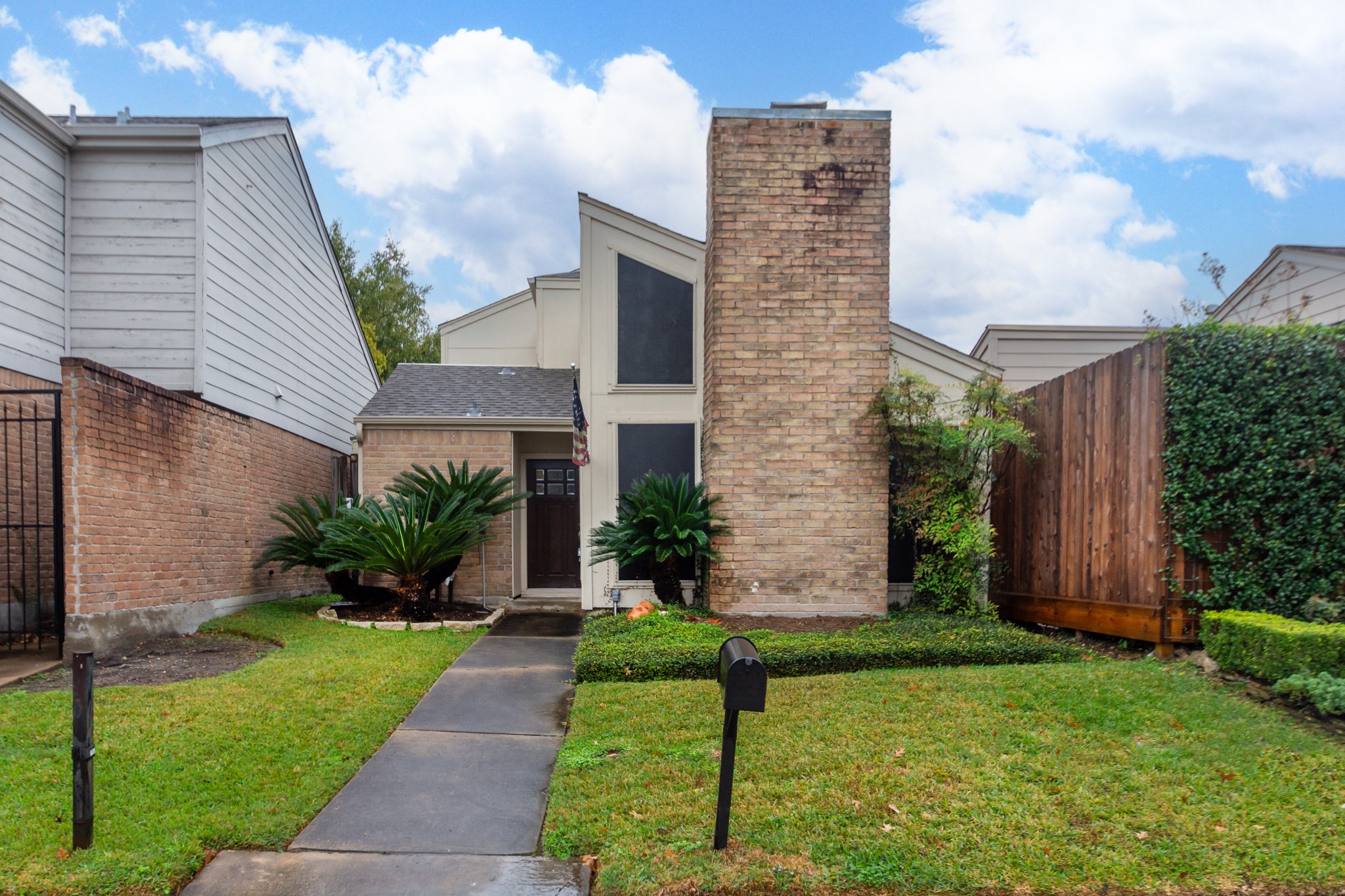 1911 Trixie Lane Houston, TX 77042 - Photo 4 of 43 a front view of a house with garden