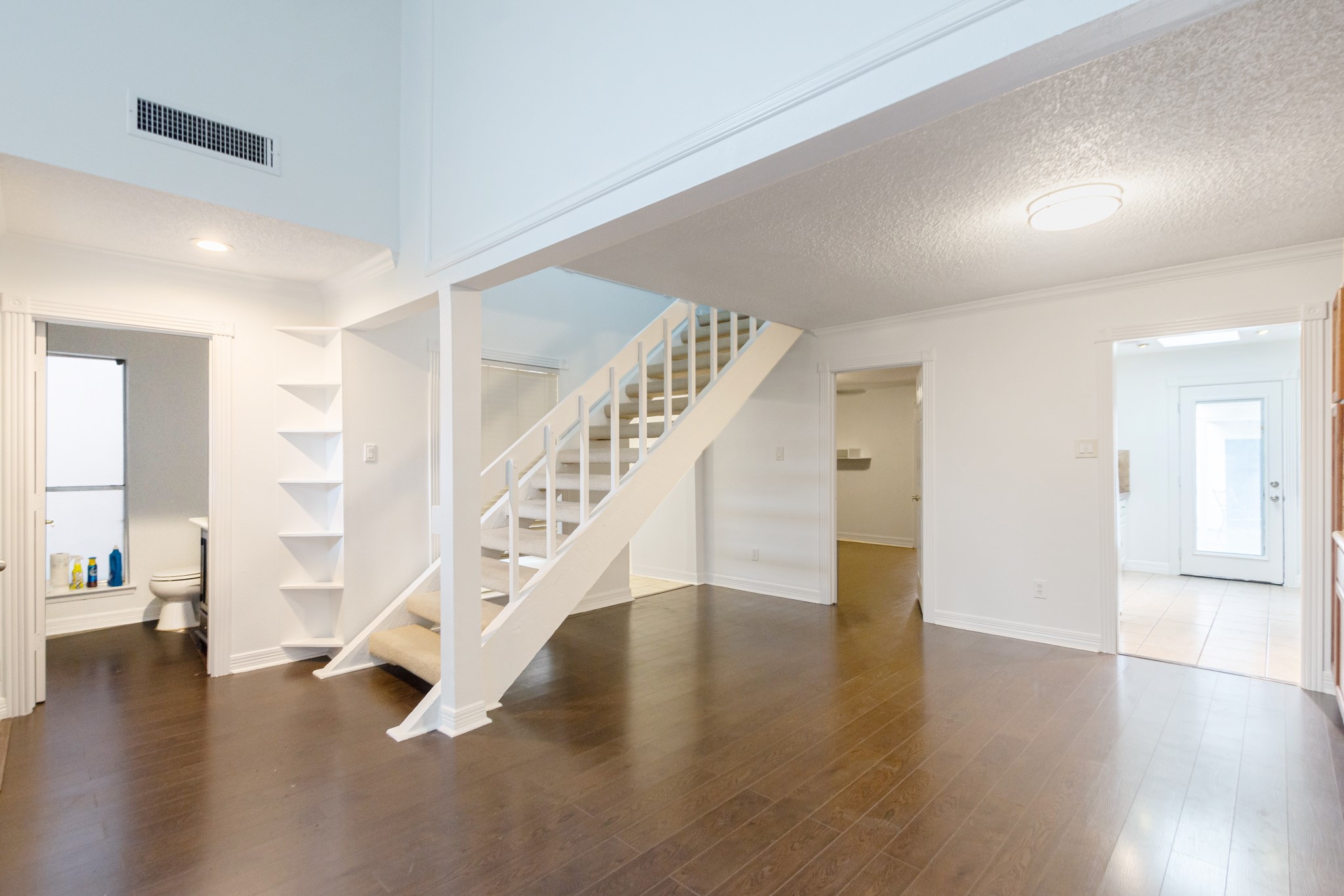 1911 Trixie Lane Houston, TX 77042 - Photo 9 of 43 a view of entryway and hall with wooden floor