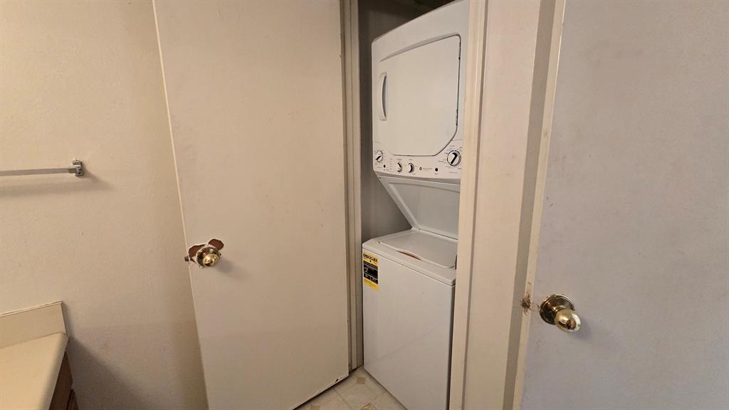 18333 Roehampton Drive, Unit 1028 Dallas, TX 75252 - Photo 6 of 8 a bathroom with a granite countertop toilet and sink