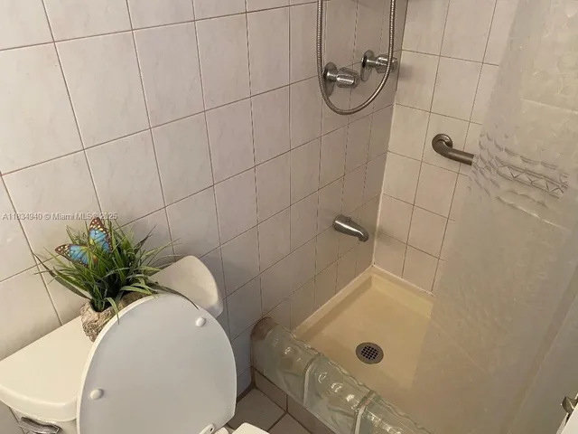 a view of a refrigerator in kitchen