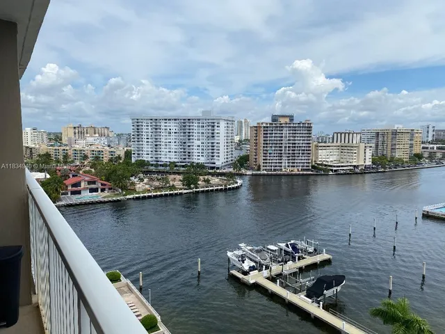 a view of a lake with tall buildings
