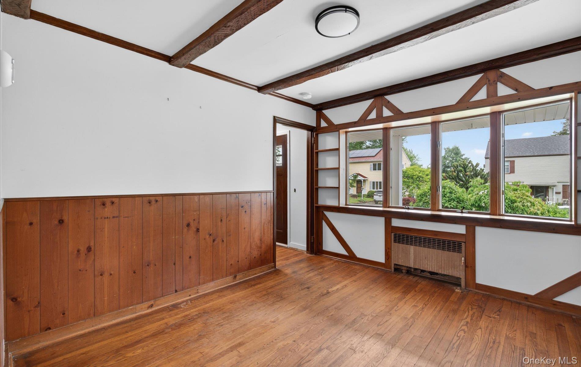 24 Purdue Road Glen Cove, NY 11542 - Photo 20 of 41 an empty room with wooden floor and windows